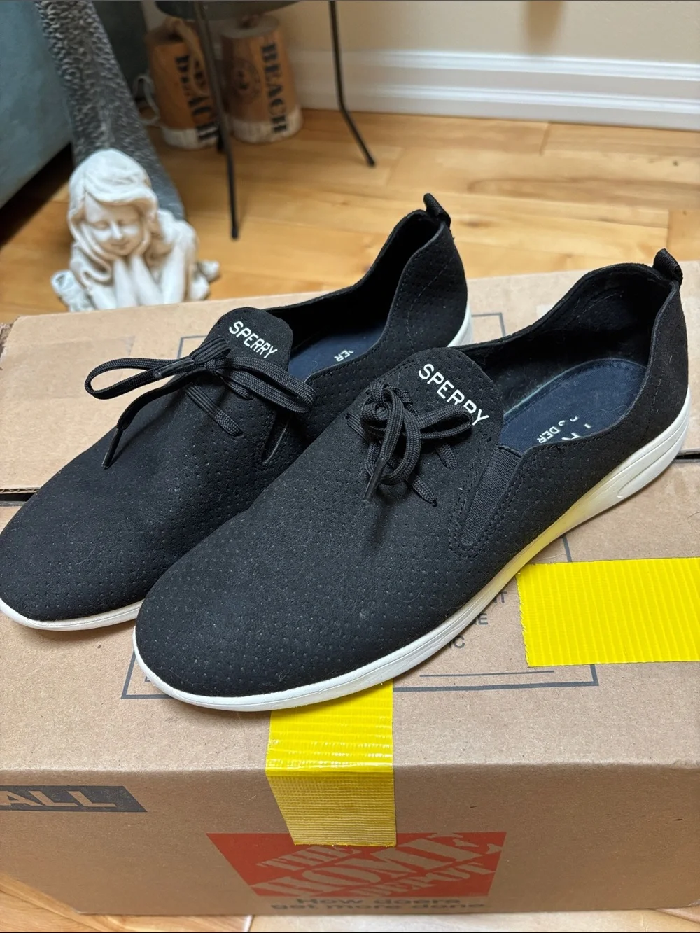 Sperry Black Perforated Slip-On Boat Shoes with White Sole